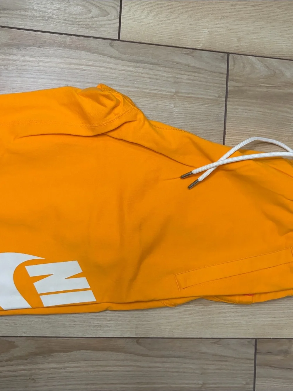 Nike Bright Orange Athletic Shorts with White Swoosh Tag